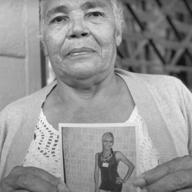 Rosa Hernández, mother of Vicky Hernández, holding a picture of her daughter.