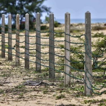 Razor wire fencing on a beach