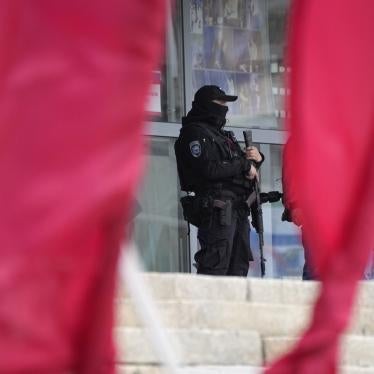 A Russian officer guards a polling station in the city of Luhansk, Ukraine, which is occupied by Russia.