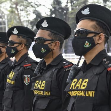 Bangladeshi RAB (Rapid Action Battalion) stand on guard at the Central Shaheed Minar in Dhaka, Bangladesh.