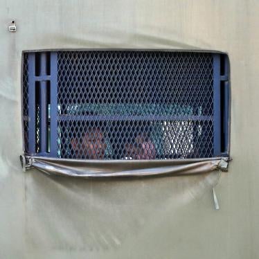 Immigration authorities transport Myanmar nationals before their deportation from Malaysia.