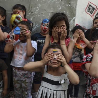 Palestinian children participate in a mental health support session.