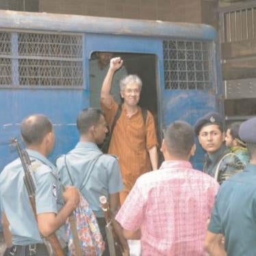 Adilur Rahman Khan, when police brought him to court on August 11, 2013. He was detained by police the prior evening and his whereabouts were kept unknown until he was brought to court.