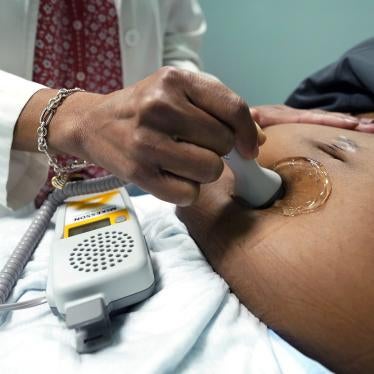 A doctor examines a pregnant woman to measure the heartbeat of the fetus, Jackson, Mississippi, US, December 17, 2021. 