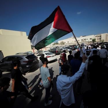 A demonstrator holds a Palestinian flag during a protest in support of Palestinians in Gaza, in Diraz, Bahrain, October 27, 2023. 