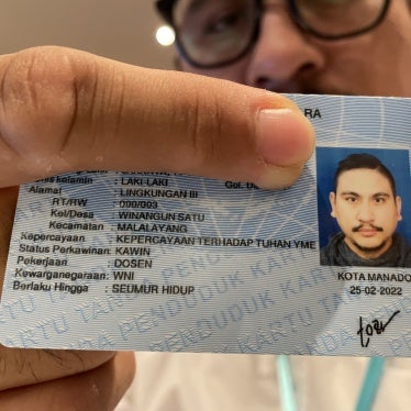  In Indonesia, a believer in Judaism shows his new ID card with the religious column, "Belief in the one God."