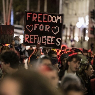 Demonstrators march on behalf of refugees and asylum seekers in Melbourne, Australia, April 19, 2021.