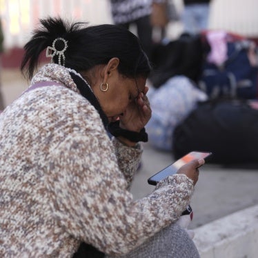 Maria Mercado, who is from Colombia but arrived from Ecuador, reacts as she sees that her appointment was canceled on the US Customs and Border Protection (CBP) One app