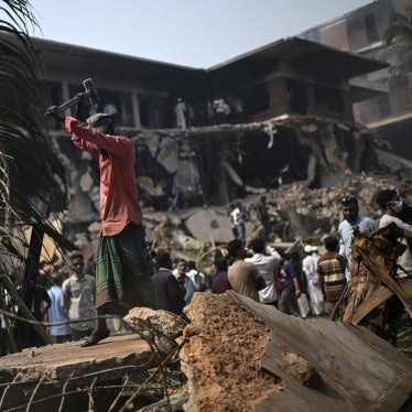 A man hammers the debris around the vandalized residence of Sheikh Mujibur Rahman, Bangladesh's former leader and the father of the country's ousted Prime Minister Sheikh Hasina, in Dhaka, Bangladesh, February 6, 2025.
