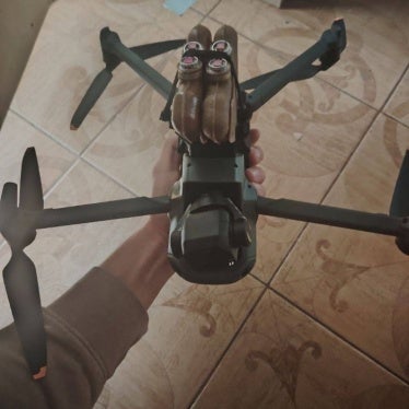 four PFM antipersonnel landmines attached to the underside of a DJI drone