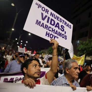 A demonstrator holds a sign which reads, "For our lives, we march today", as people attend a protest against crime and insecurity