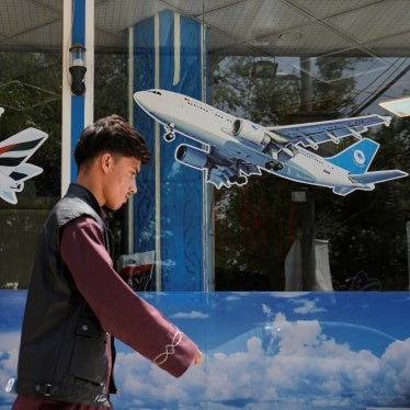 A man walks in front of an air travel agency in Kabul, Afghanistan