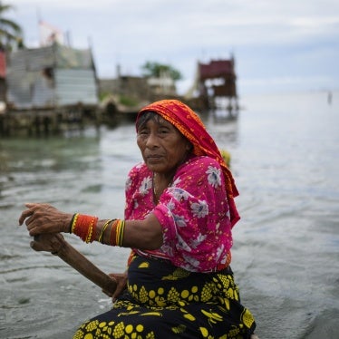 A person from the Guna Indigenous community along the shore of Gardi Sugdub Island, off Panama's Caribbean coast.