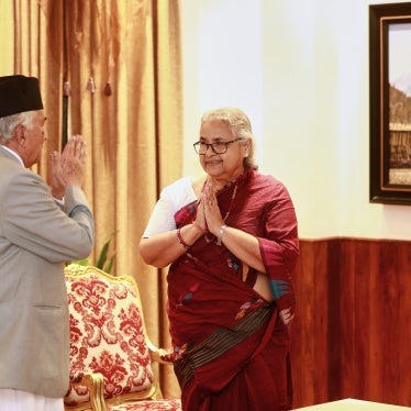 Former Supreme Court Chief Justice Sushila Karki greets President Ram Chandra Poudel after taking the oath as interim prime in Kathmandu, September 12, 2025.