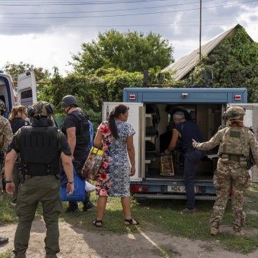 Policemen and medics help move people from an armored car to an ambulance in the village of Yarova,  Donetska region. On September 9, 2025, Yarova was hit by a Russian aerial strike, which killed dozens of civilians. 
