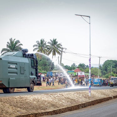 A Tanzanian police water cannon shoots water at opposition party supporters during a protest in Kigoma, Tanzania, on October 30, 2025, a day after Tanzania's presidential and legislative elections.