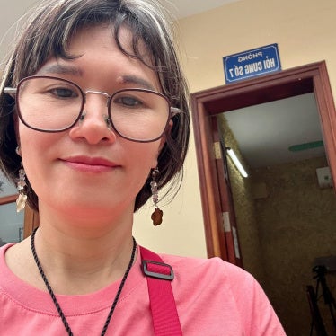 Hoang Thi Hong Thai outside the police interrogation room in Hanoi, April 2025.