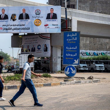 An electoral banner showing the candidates running for Egypt's National Front Party in Senate elections in Giza, in July 2025.