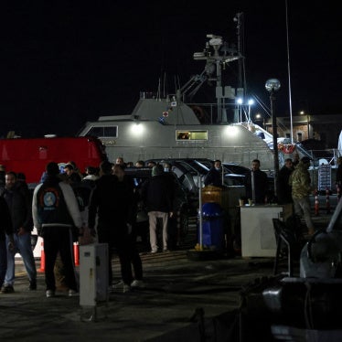 Greek emergency personnel wait to transfer bodies of dead migrants, following migrant's boat collision with coast guard off the island of Chios, in the port of Chios, Greece, February 3, 2026. 