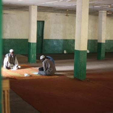 Men praying at the Koudoukou central mosque in the Kilomètre 5 neighborhood of Bangui, CAR. Some 3,000 people sought shelter on the grounds of the mosque after fleeing anti-balaka attacks in January 2014. 