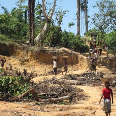 Women and children carry pans of ore at Dompim mining site, Tarkwa-Nsuaem district, Western Region.