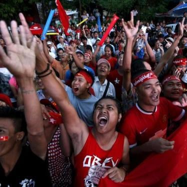 Supporters of Aung San Suu Kyi gather outside National League for Democracy headquarters (NLD) in Rangoon on November 9.