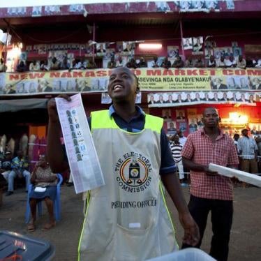 Ugandan poll workers count ballot papers at Nakasero Market polling station in Uganda’s capital Kampala on February 18, 2011. 