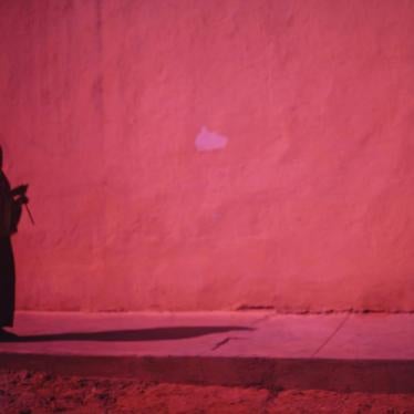 A Somali woman walks alone in central Mogadishu.
