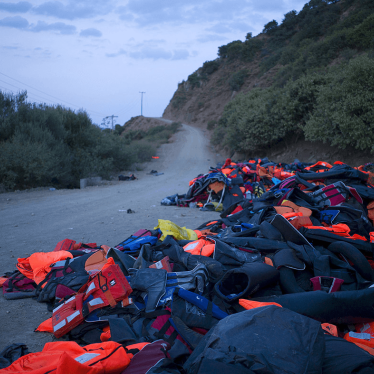 Life jackets and deflated dinghies left behind by refugees and migrants are seen on the roadside near a beach on Lesbos, Greece.