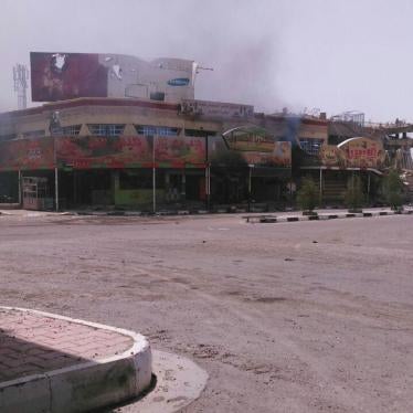Smoke from shops in Fallujah a witness said Popular Mobilization Forces burned on June 27 