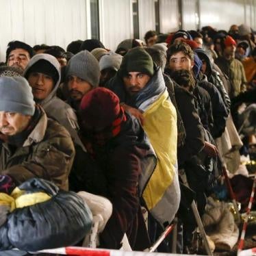 Migrants and asylum seekers wait to be registered outside the Berlin Office of Health and Social Affairs (LAGESO) in Germany, December 9, 2015.