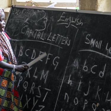 An eager student leads her class in learning the alphabet in September 2015 at a displacement camp housed at a school in Maiduguri, Borno state. © 2015 Bede Sheppard, Human Rights Watch