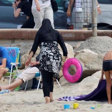 A Muslim woman wears a burkini, a swimsuit that leaves only the face, hands and feet exposed, on a beach in Marseille, France, August 17, 2016.