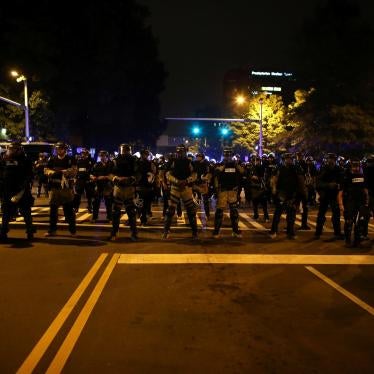 Police in riot gear block a roadway to stop demonstrators from entering a neighborhood as they protest the police shooting of Keith Scott in Charlotte, North Carolina, U.S., September 25, 2016.