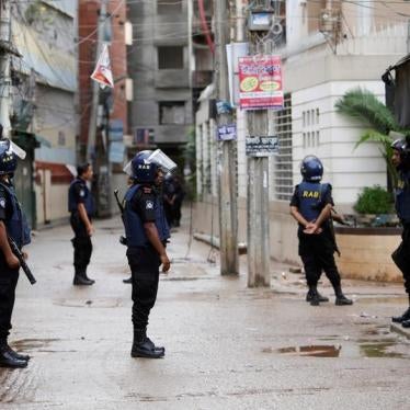 Security personnel block a road during a police operation in Dhaka, Bangladesh on July 26, 2016.