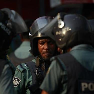 Police stand guard during a rally by activists demanding capital punishment for a group of bloggers in Dhaka, Bangladesh on April 12, 2013.
