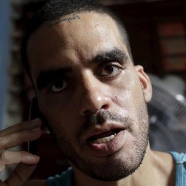 Cuban graffiti artist Danilo Maldonado speaks on his cellphone in his house in Havana on October 20, 2015. 