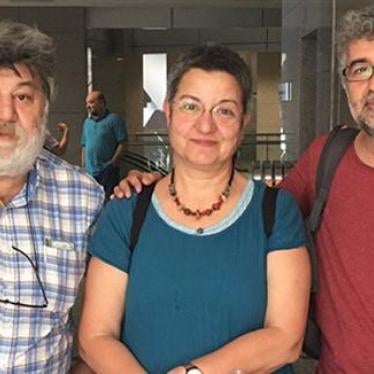 Ahmet Nesin, Şebnem Korur Fincancı and Erol Önderoğlu at the court house in Istanbul hours before being jailed pending investigation into spurious allegations of “making terrorist propaganda.”