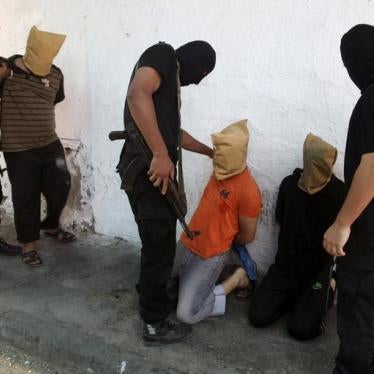 In Gaza, fighters from Hamas’s armed wing prepare to execute men accused of collaborating with Israel during the 2014 war.