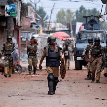 Indian policemen patrol a street following a protest in Srinagar, against the recent killings in Kashmir, August 30, 2016