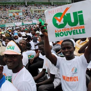 A man holds a placard during a rally, ahead of the referendum for a new constitution, in Abidjan, Côte d’Ivoire on October 22, 2016. The placard reads “Yes to a new Côte d’Ivoire.”