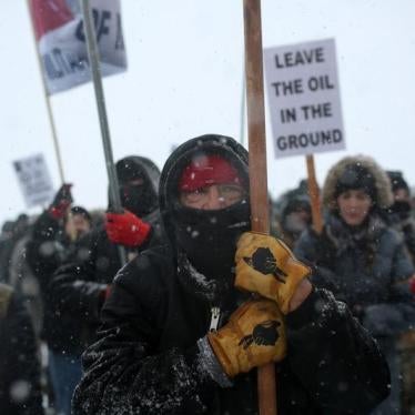 A Native American man leads a protest march with veterans and activists outside the Oceti Sakowin camp at the Standing Rock Indian Reservation, near Cannon Ball, North Dakota, U.S., December 5, 2016.