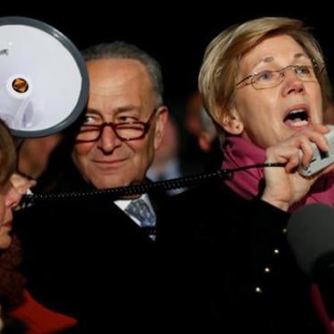 Senator Elizabeth Warren (D-MA) speaks during a rally against President Donald Trump's travel ban outside the Supreme Court.