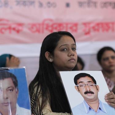 Relatives hold portraits of disappeared family members at an event calling for the end of enforced disappearances, killings, and abductions, in Dhaka, Bangladesh, August 30, 2014. 