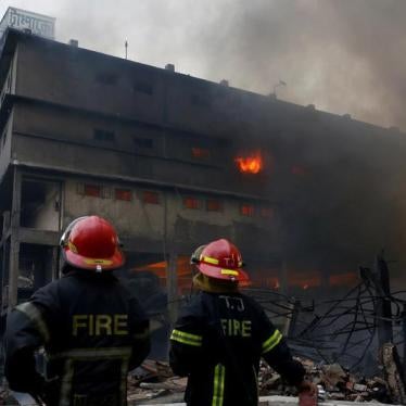 In September 2016, another factory burned in the same district. Here, firefighters stand at the site of a fire at a packaging factory outside Dhaka, Bangladesh, September 10, 2016.
