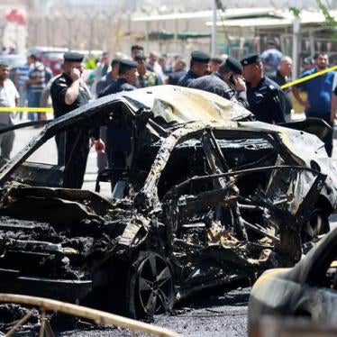 A wreckage of a car is seen at the site of car bomb attack near a government office in Karkh district in Baghdad, Iraq.
