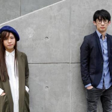 Disqualified lawmakers Yau Wai-Qing, 25, (L) and Baggio Leung, 30, pose outside government headquarters in Hong Kong, China on March 28, 2017. The two were arrested on April 26, 2017. 