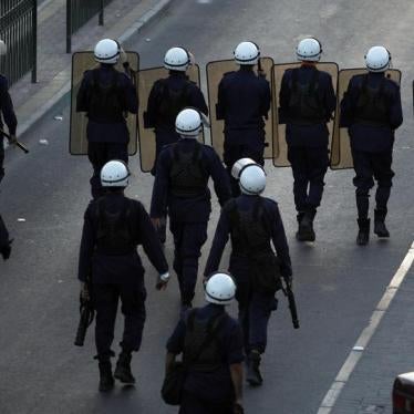 Riot police confront protesters in a village south of Manama on November 24, 2011, the day after King Hamad accepted the findings of the Bahrain International Commission of Inquiry (BICI) that the Interior Ministry and the National Security Agency engaged