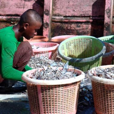 A young Burmese fisher sorts trash fish onboard a trawler in Laem Sing, Chantaburi, November 11, 2016. 