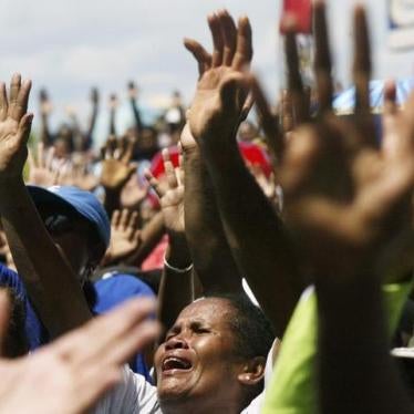 Christian Papuans sing a religious song during a protest in Jayapura of the Indonesia Papua province August 5, 2008. About 1,000 Papuan rally on Tuesday against Indonesian government's plan to implement Islamic sharia law in the Christian stronghold. REUT
